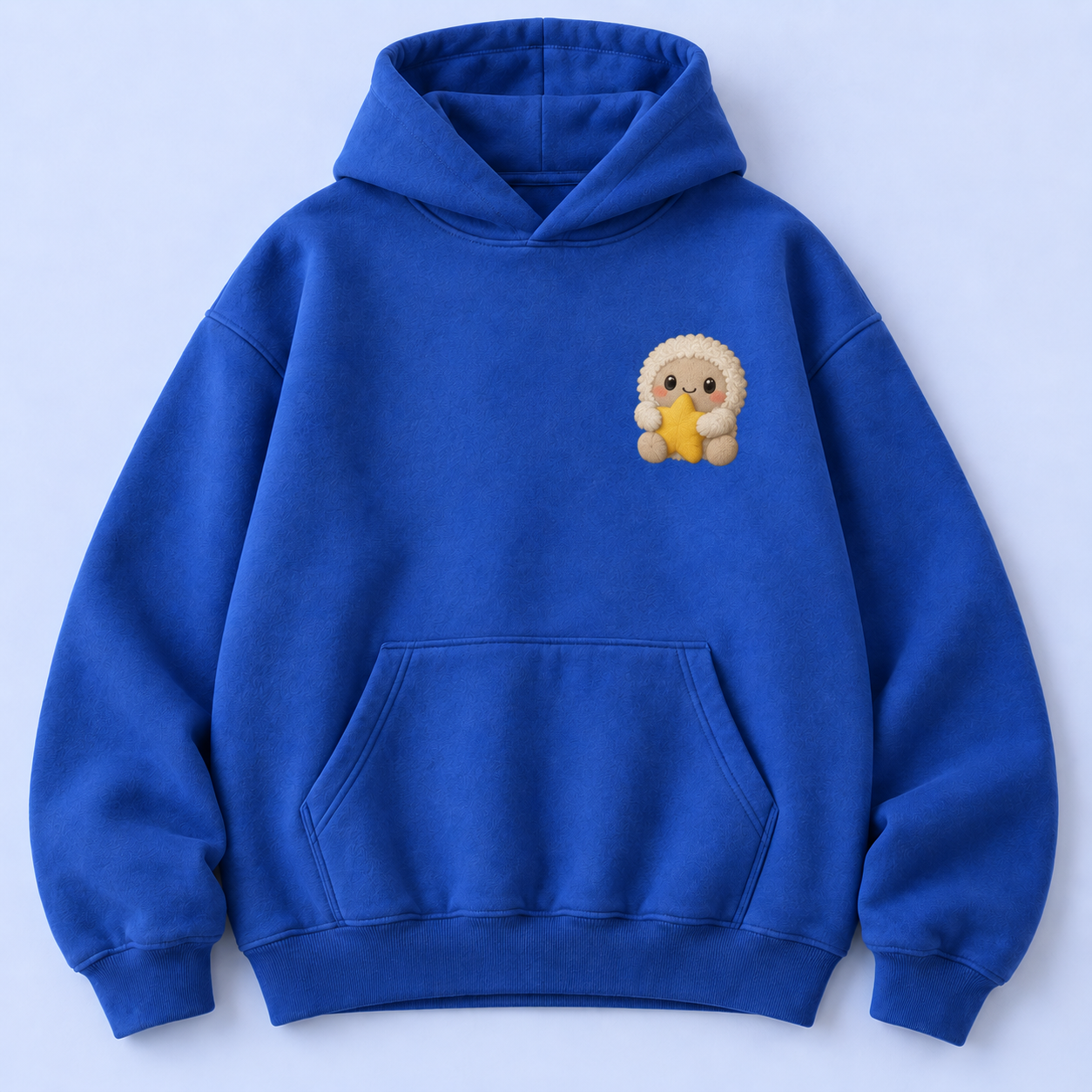 Cobalt hoodie concept with fluffy cream Joy Boy hugging a yellow star